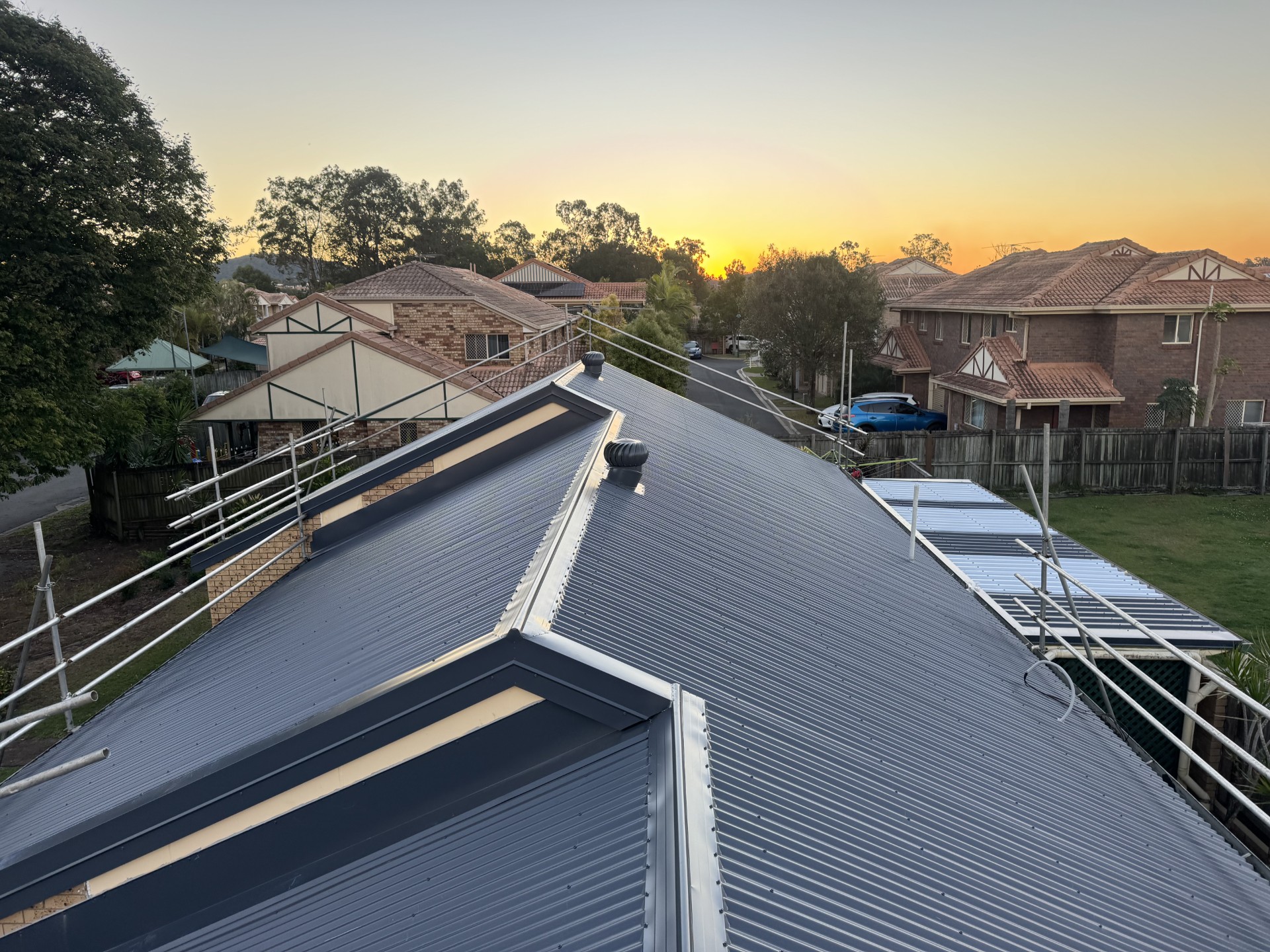 Premium Colorbond roof replacement on a Gold Coast home at sunset by ELEV8 Roofing
